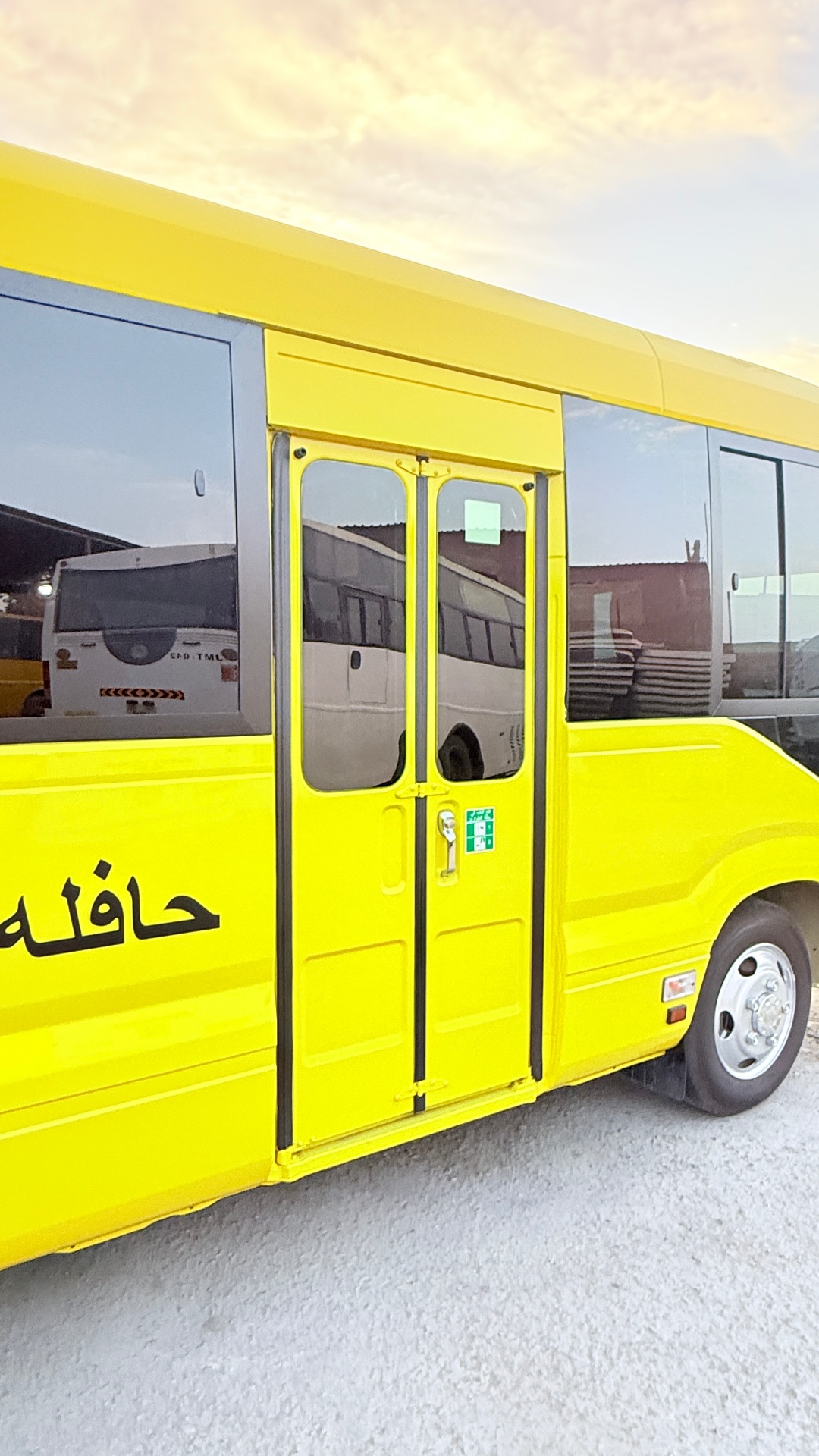 Folding entry door with safety grab rail