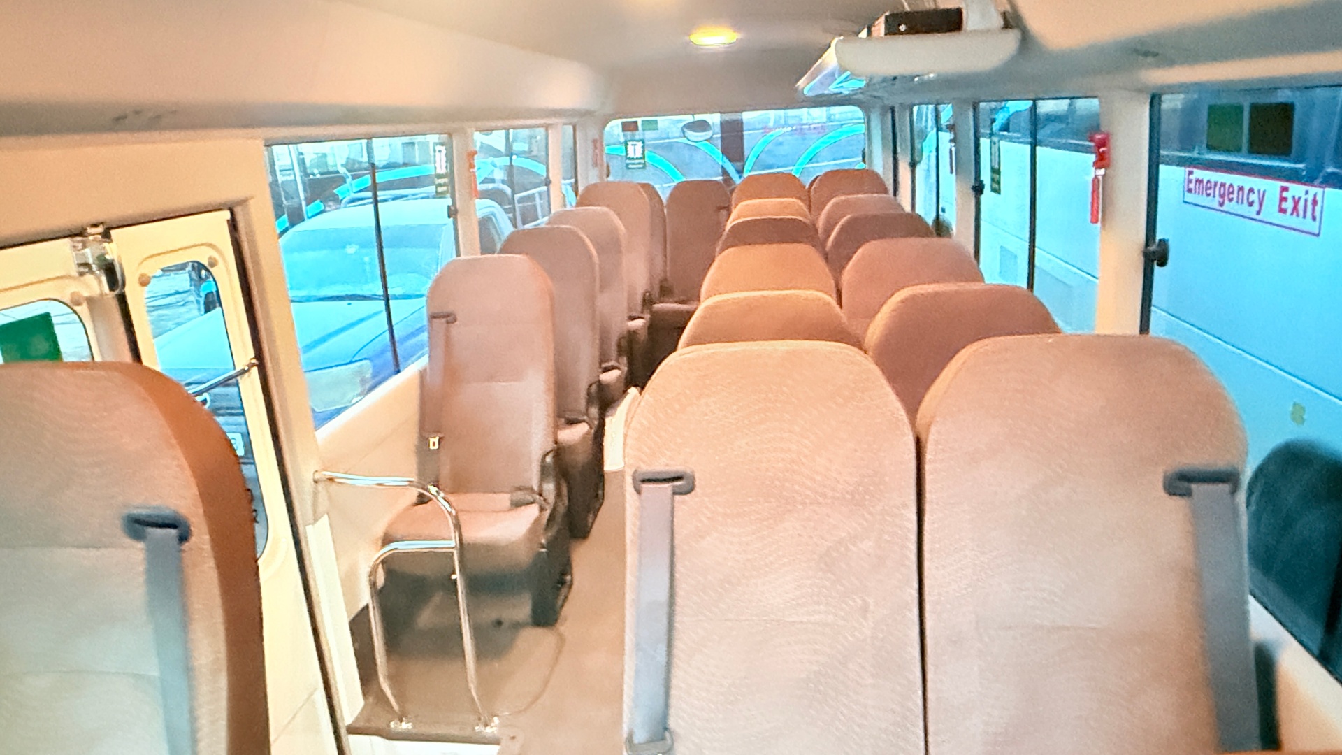 Interior — 23 padded seats with belts