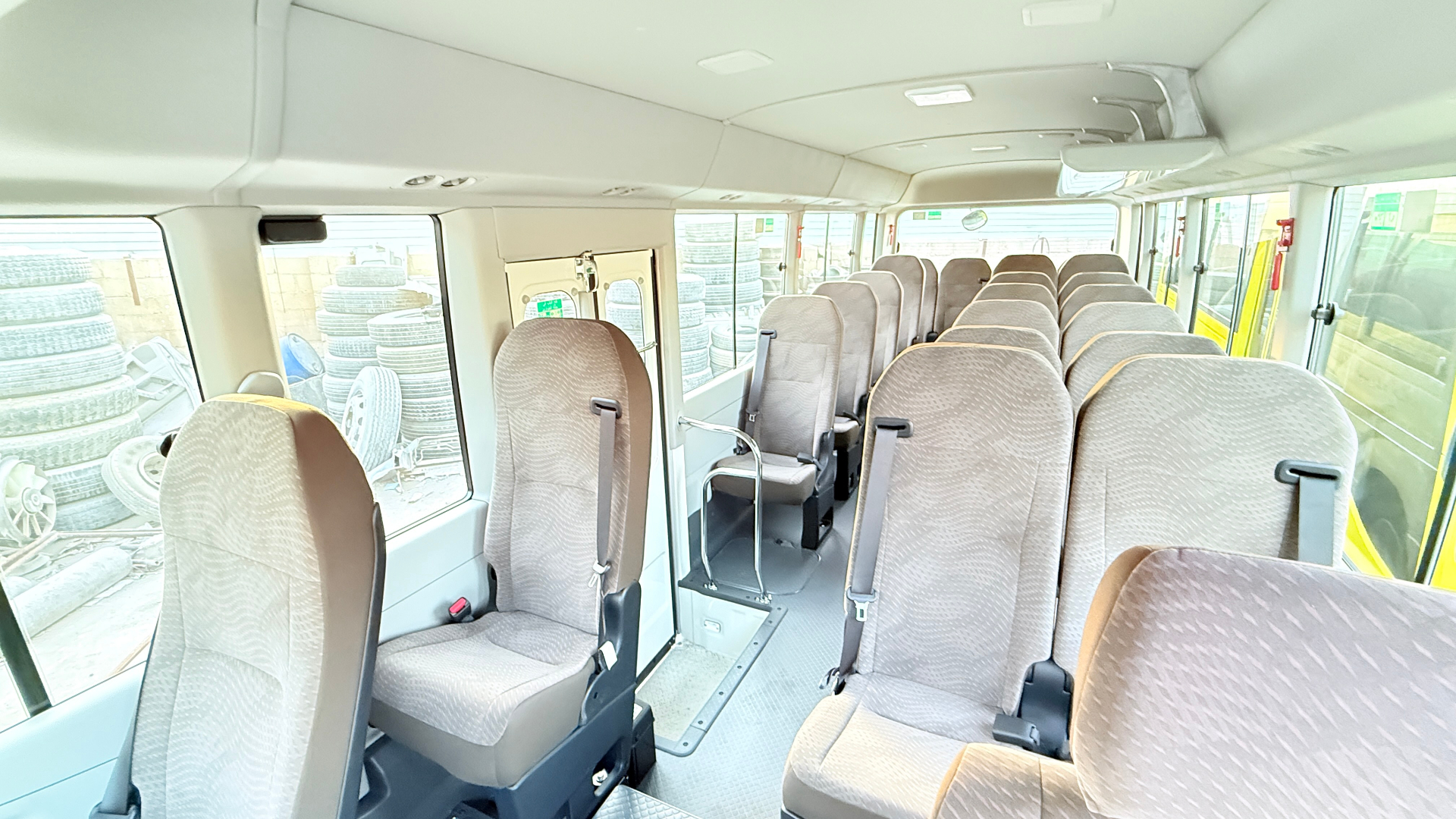 Interior — 20+ cloth seats with belts